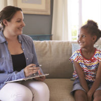 Therapist with young girl